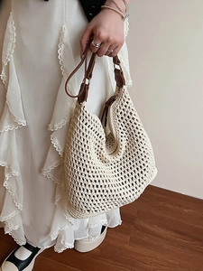 Hollow out woven shoulder bag with brown leather straps for casual beach vacation style