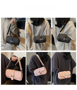 Detail view of contrast color crossbody bags with woven texture and metal buckles