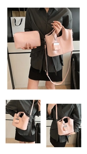 Three-piece pink tote bag set with matching pouch and chain charm in smooth finish