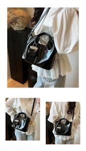 Detail view of a glossy black tote bag with lock charm showing multiple carrying angles