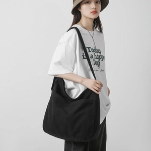 Large capacity black canvas crossbody bag for women with wide shoulder strap