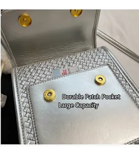 Silver woven texture bag interior featuring functional pocket and golden magnetic buckles