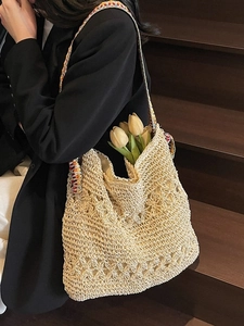 Beige hollow-out straw woven tote bag with bohemian embroidered strap for beach travel