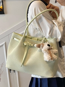 Women's light green woven tote bucket bag with metallic buckle and cute bear charm