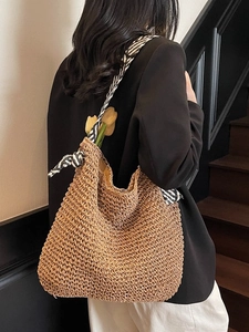 Large woven straw hobo bag with striped scarf handle for summer beach vacation