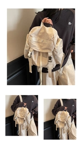 Detailed view of the multi-pocket cream nylon functional backpack for daily casual use