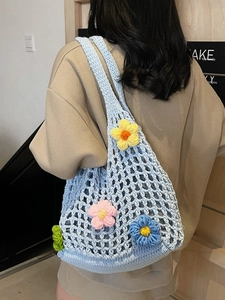 Hollow out light blue knit tote bag with colorful crochet flowers and shoulder strap