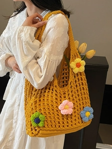 Handmade hollow crochet shoulder bag in yellow with 3D colorful floral accents