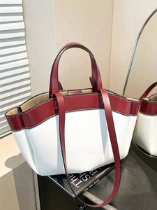 Minimalist red and white tote bag with top handles and shoulder strap for daily use