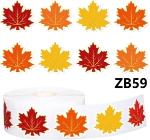 Macro shot of maple leaf stickers roll with golden glitter veins for autumn decoration