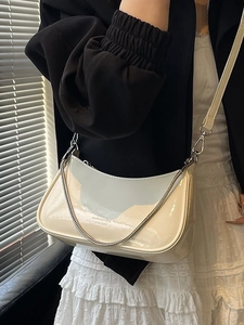 Chic cream white patent leather half-moon shoulder bag with silver chain and crossbody strap