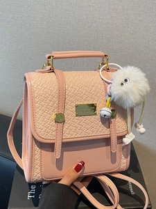 Pink PU leather handbag with crocodile pattern flap and white plush monster charm accessory
