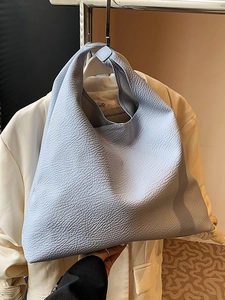 Light blue lychee grain leather tote bag with large capacity hobo design and wide shoulder strap