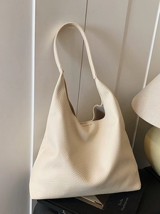 Minimalist beige large capacity tote bag in pebbled leather with long shoulder strap