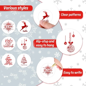 Gros plan d'autocollants de Noël rouges et blancs avec flocons et motifs de renne