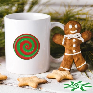 Detailed view of white ceramic mug featuring red and green spiral candy print for Christmas