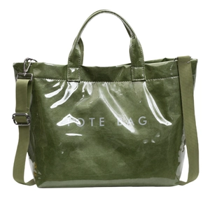 Large dark green tote bag in unique paper texture with crossbody strap and tote bag print