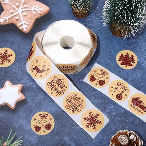 Close-up of buffalo plaid Christmas stickers roll with snowflakes and reindeer designs