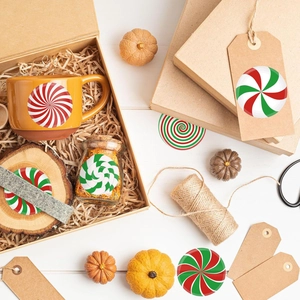 Christmas peppermint candy stickers applied to mugs, glass jars and gift tags decor