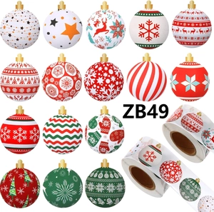 Detail of 15 festive Christmas ball sticker designs on a roll with red and gold patterns