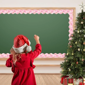 Pink Christmas bulletin board border with gold snowflakes in a decorated classroom setting