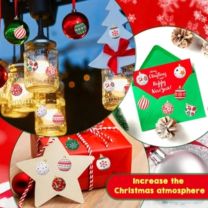 Roll of 500 Christmas decorative stickers with festive balls and snowflake patterns