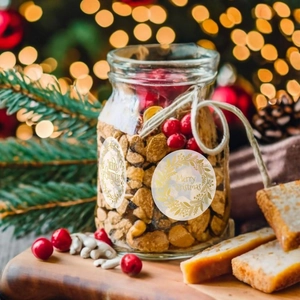Transparent gold foil Christmas wreath stickers on glass jars for festive gift packaging