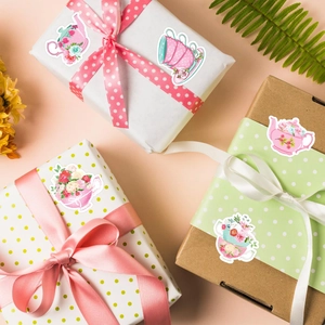 Floral tea party sticker roll featuring pink rose teacups on gift boxes for scrapbooking
