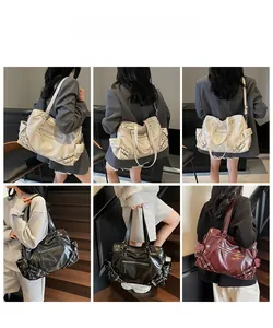 Three colors of oversized tote bags in cream, black and burgundy shown on model