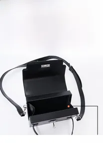 Macro view of the internal structure and spacious compartment of the black leather bag