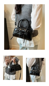 Detail of black glossy small square bag with cross straps and bow design for women