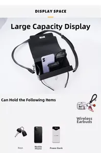 Detail view of black trapezoid bag interior showing capacity for phone and sunglasses