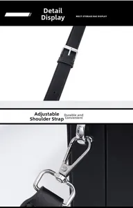 Detail of adjustable leather strap with durable silver metal buckle on a black shoulder bag