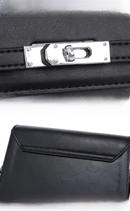 Detail view of reinforced silver metal hardware and precise stitching on black leather bag