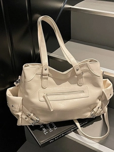 Chic beige studded tote bag with large capacity for urban casual or retro style