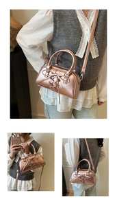 Close-up of metallic rose gold mini bag with decorative front bow and mirror finish texture