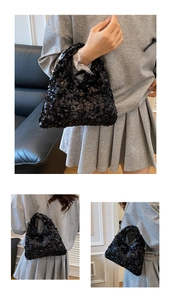 Close-up of shimmering black sequins on a fashionable chain shoulder bag for women