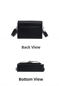 Detailed back and bottom view of the minimalist black leather shoulder bag with wide strap