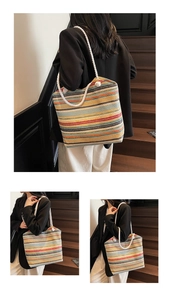 Detail showing colorful striped woven tote bag with white rope handles on stairs
