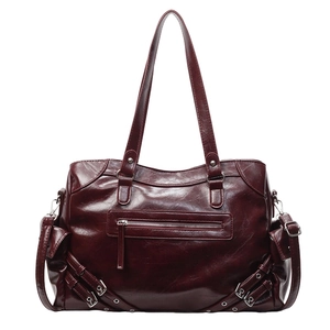Deep burgundy large tote bag with glossy leather finish and side buckle belt details