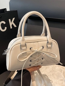 Chic cream white crossbody bag with decorative bow and top handle for women