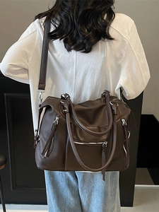 Retro dark brown large tote bag in pebble leather with multiple silver zippers and straps
