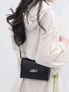 Classic black kelly-style crossbody bag in matte faux leather with silver metal turn-lock