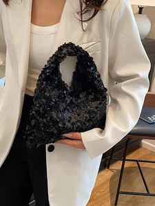 Sparkling black sequin handbag with chic wide handle for elegant evening parties