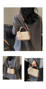 Detail view of woven leather mini bag with silk scarf handle and crossbody strap
