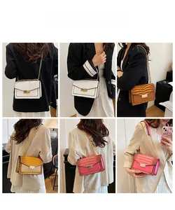 Detail view of colorful crocodile pattern flap crossbody bags with gold V-shaped buckle