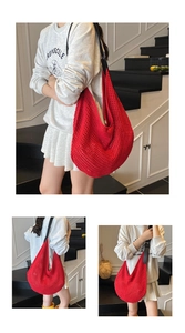 Detail of red crochet mesh hobo bag with adjustable black leather shoulder strap
