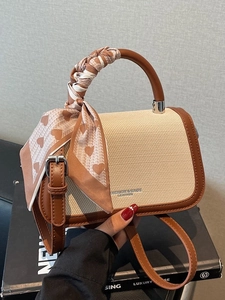 Chic beige woven mini crossbody bag with dark brown leather trim and silk scarf handle