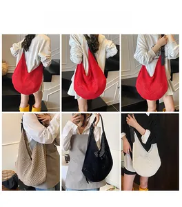 Hobo tote bag in woven mesh fabric featuring leather straps shown in multiple colors