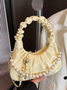 Chic creamy yellow ruched cloud bag with elegant pearl chain and PU leather finish